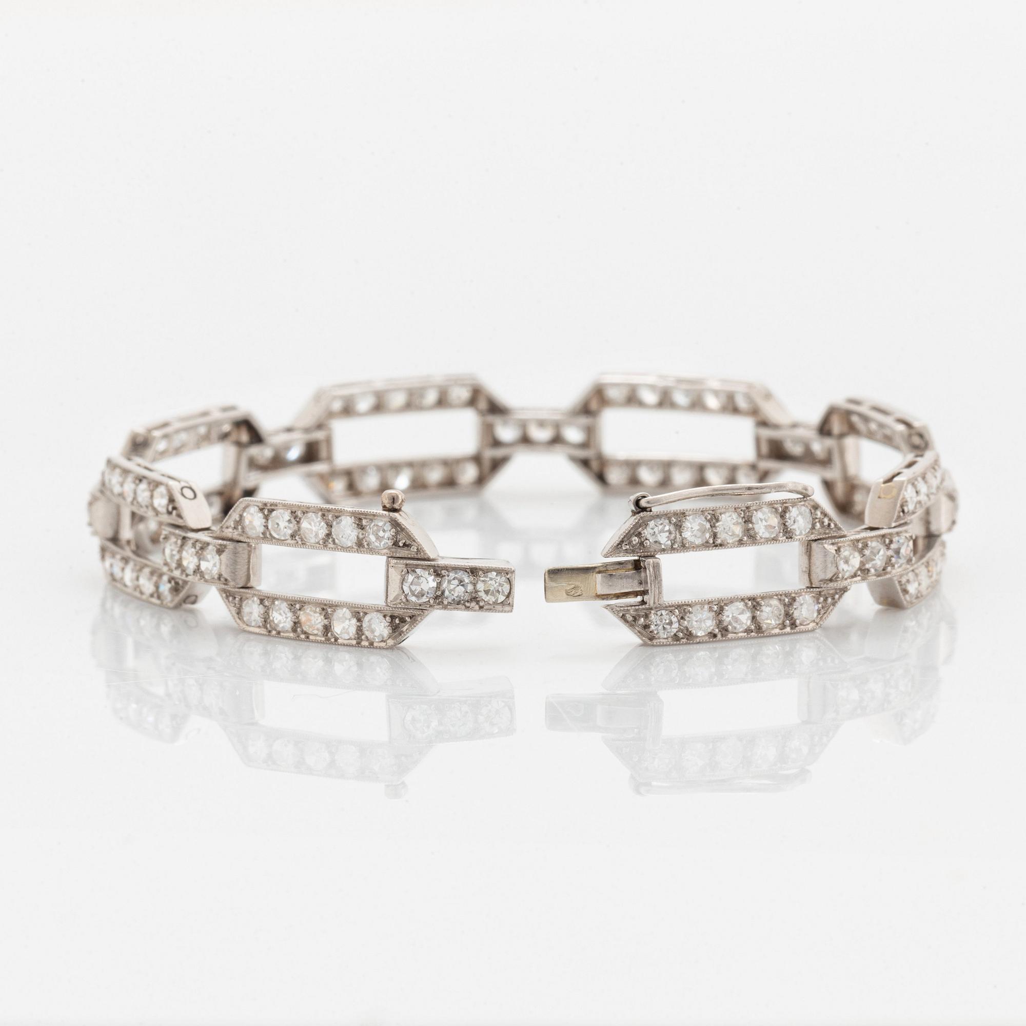A platinum bracelet set with old-cut diamonds.