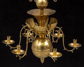 A SIX-LIGHT BRASS CHANDELIER, Swedish Grace, signed Lars Holmström Arvika.