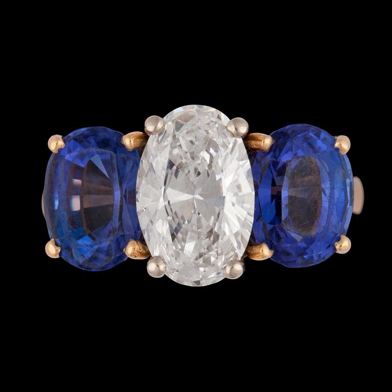 An oval brilliant cut diamond, app. 2.10 cts and tanzanite ring.