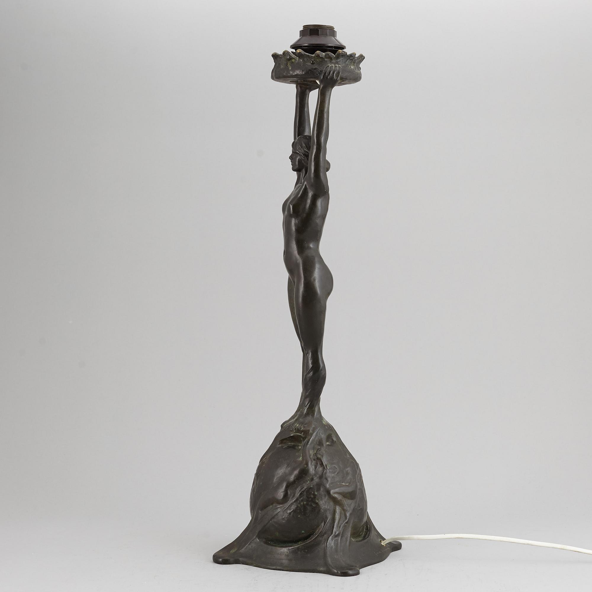 GERDA SPRINCHORN, an Art Nouveau green patinated bronze lamp "The Sun", Herman Bergman, Stockholm, early 20th century.