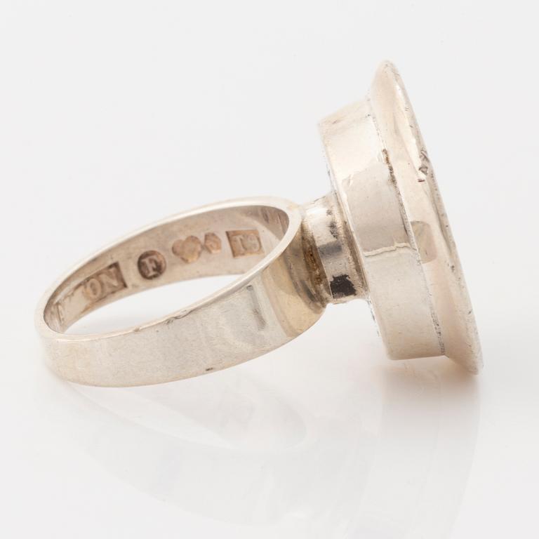 A sliver ring with gilded parts and a synthetic spinel. Alton, Falköping 1969.