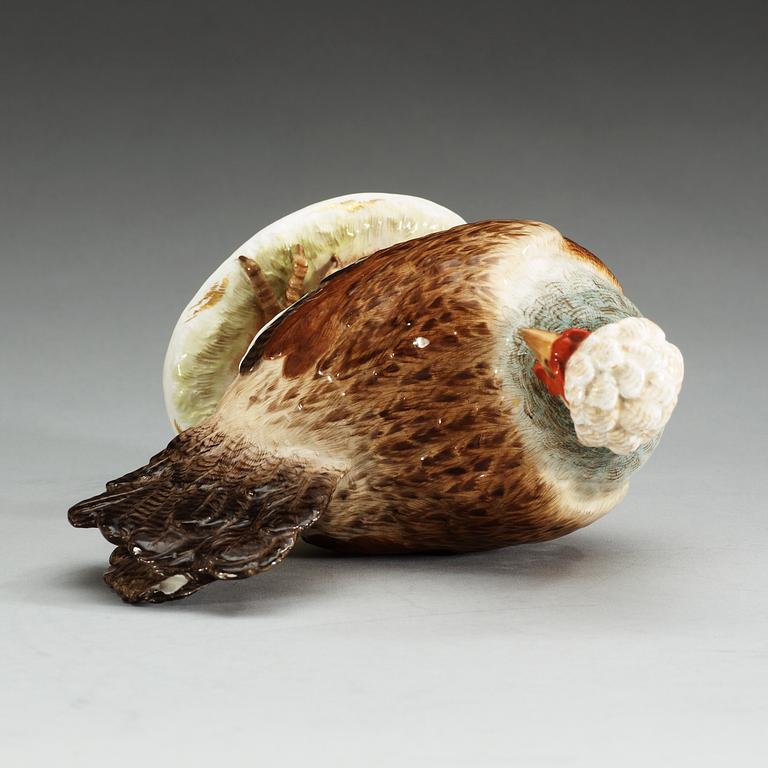 A Meissen figure of a hen with an egg, 19th Century.