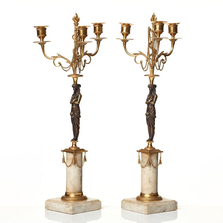 A pair of late Gustavian circa 1800 three-light candelabra.