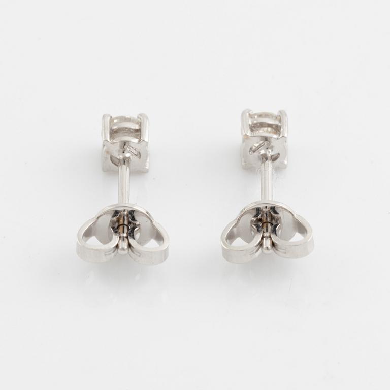 Brilliant cut diamond stud earrings.