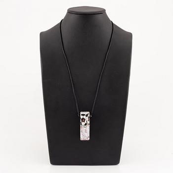 César Baldaccini, compression, pendant made of compressed beer bottle caps.