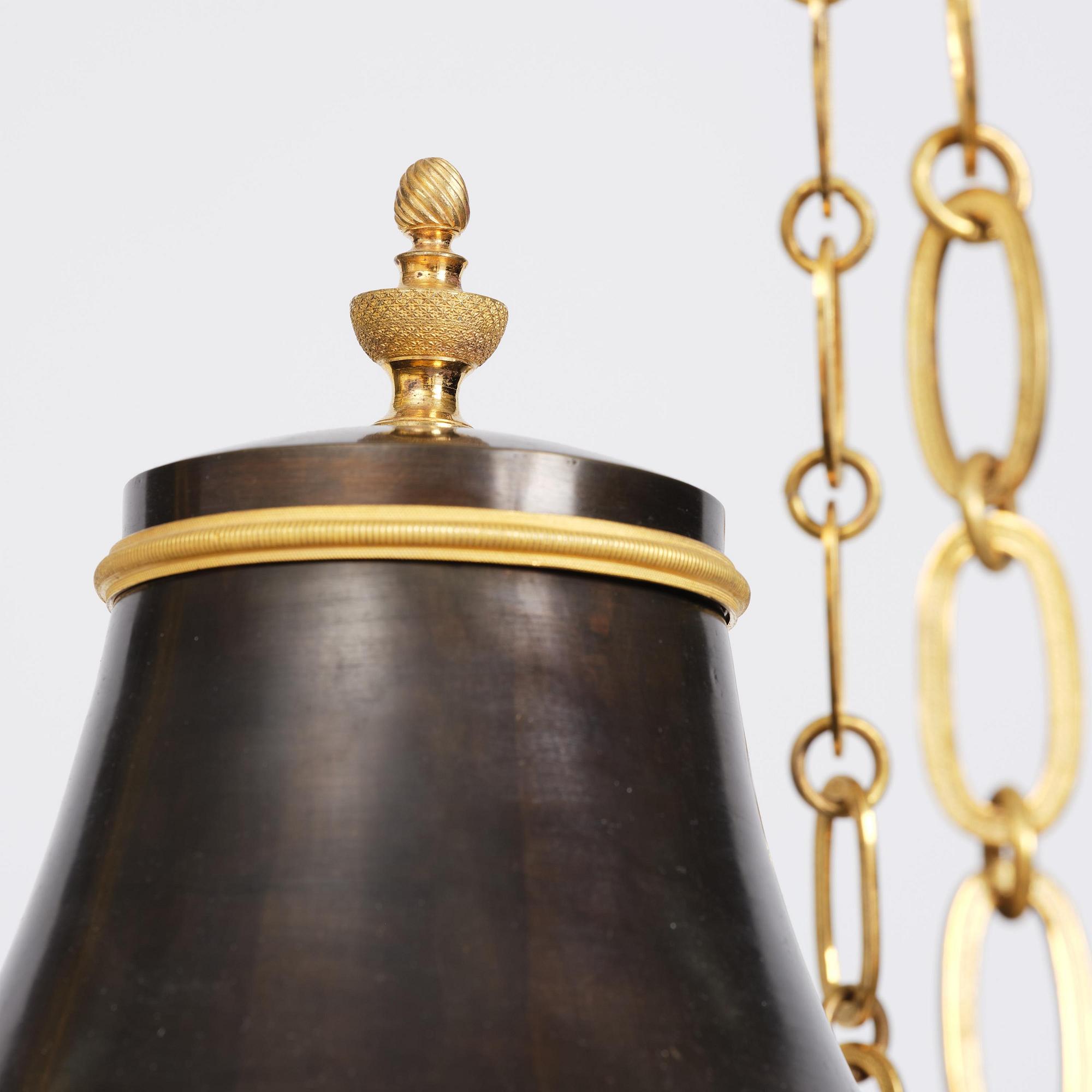 A Swedish Empire ormolu and patinated six-branch chandelier, Stockholm, early 19th century.