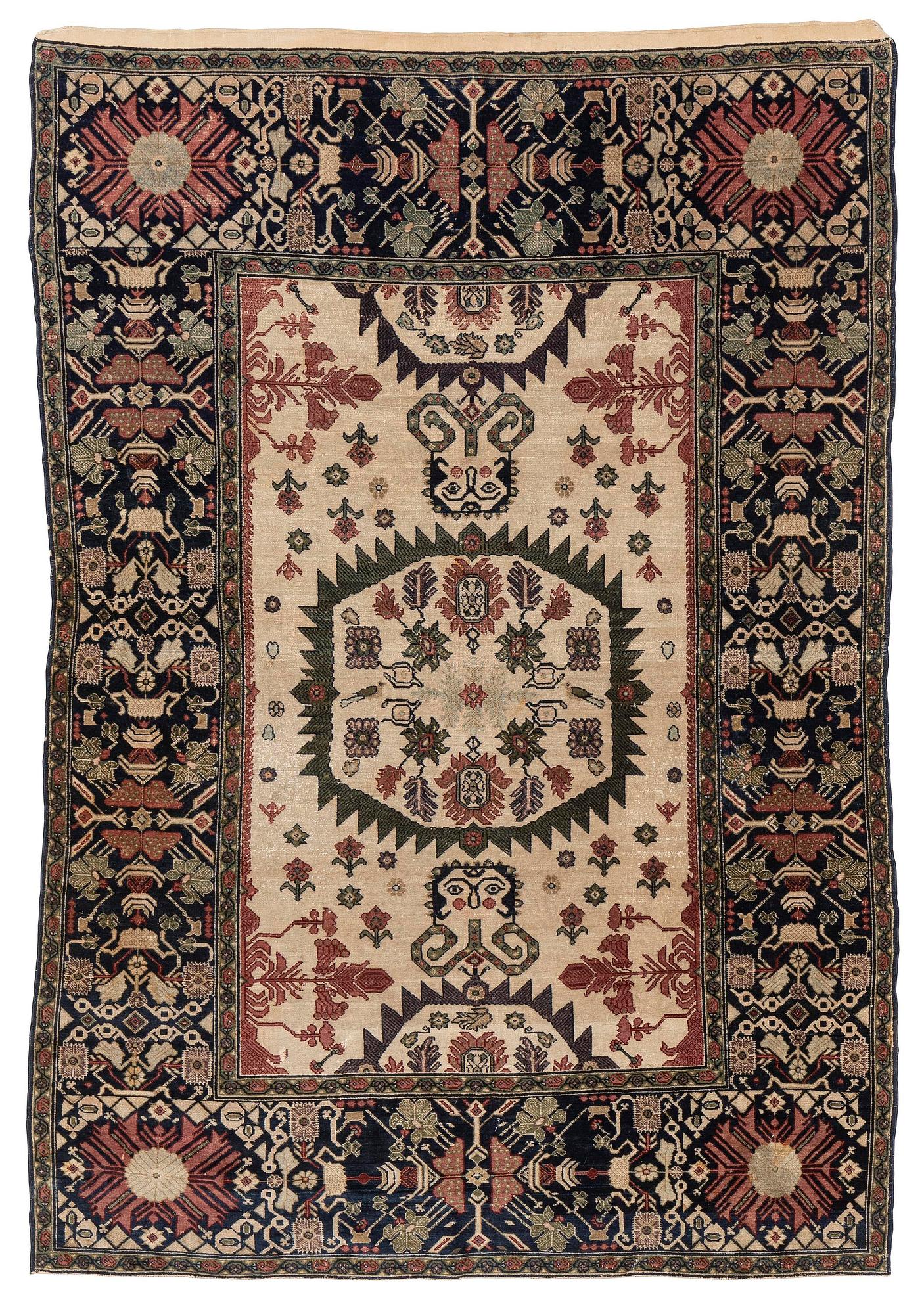 An antique Malajir rug, c. 179,5 x 124 cm (as well as one end with 2.5 cm flat weave).