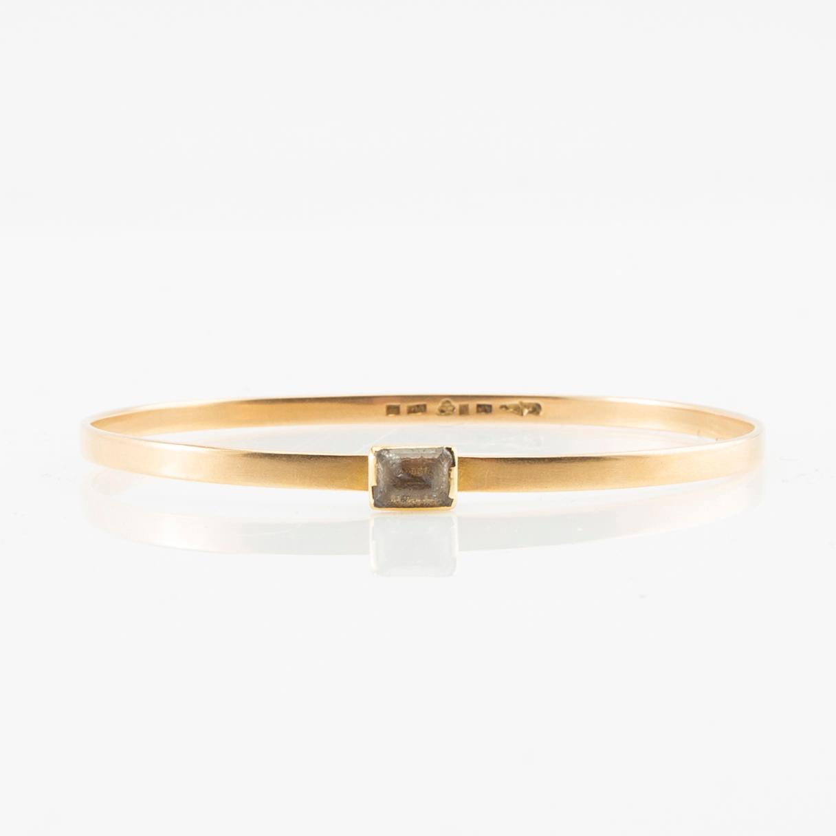 Wiwen Nilsson, Armring 18K gold with a synthetic white spinel, Lund 1967.