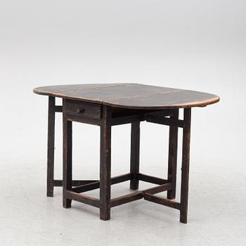 A Swedish wooden table, 19th century.
