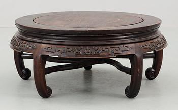 A round hardwood table, Qing dynasty.