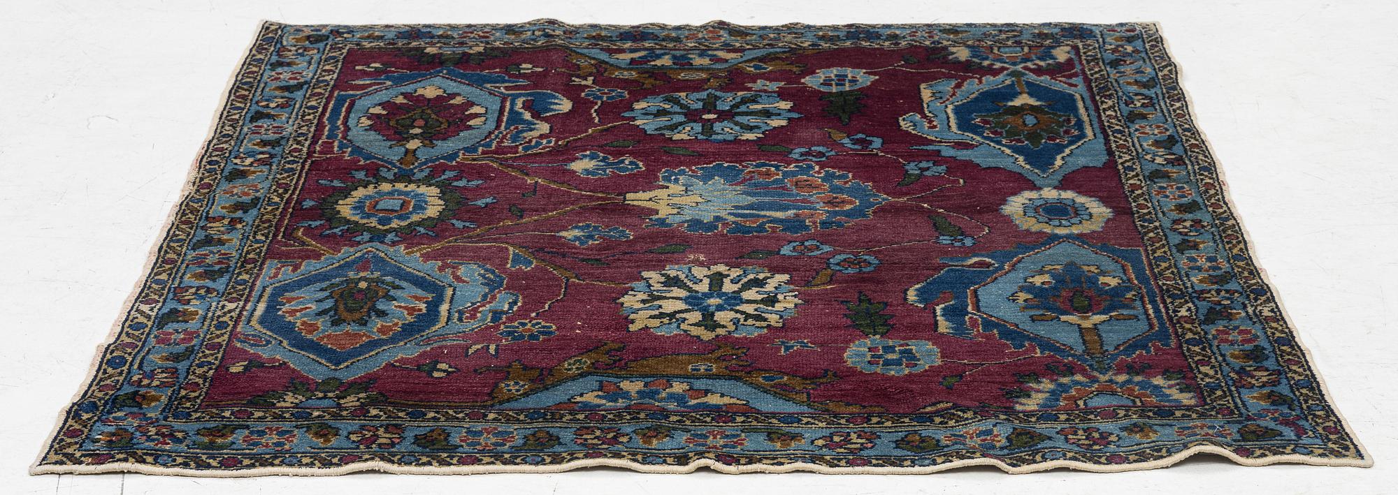 An antique rug, north-west Persian, so-called Vaghire, approx. 136 x 134 cm.