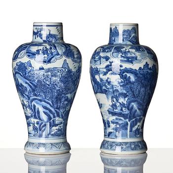A pair of blue and white 'landscape' vases, Qing dynasty, Kangxi (1662-1722).