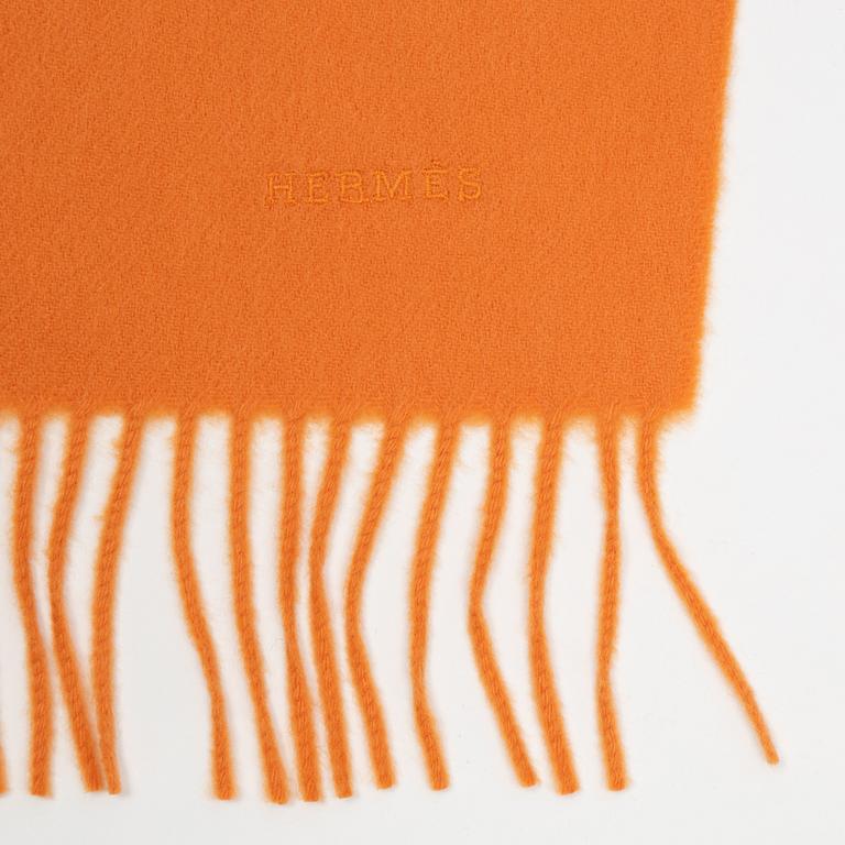 Hermès, a orange cashmere scarf.