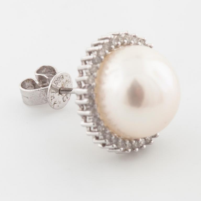 A pair of mabe pearl and brilliant cut diamond earrings.