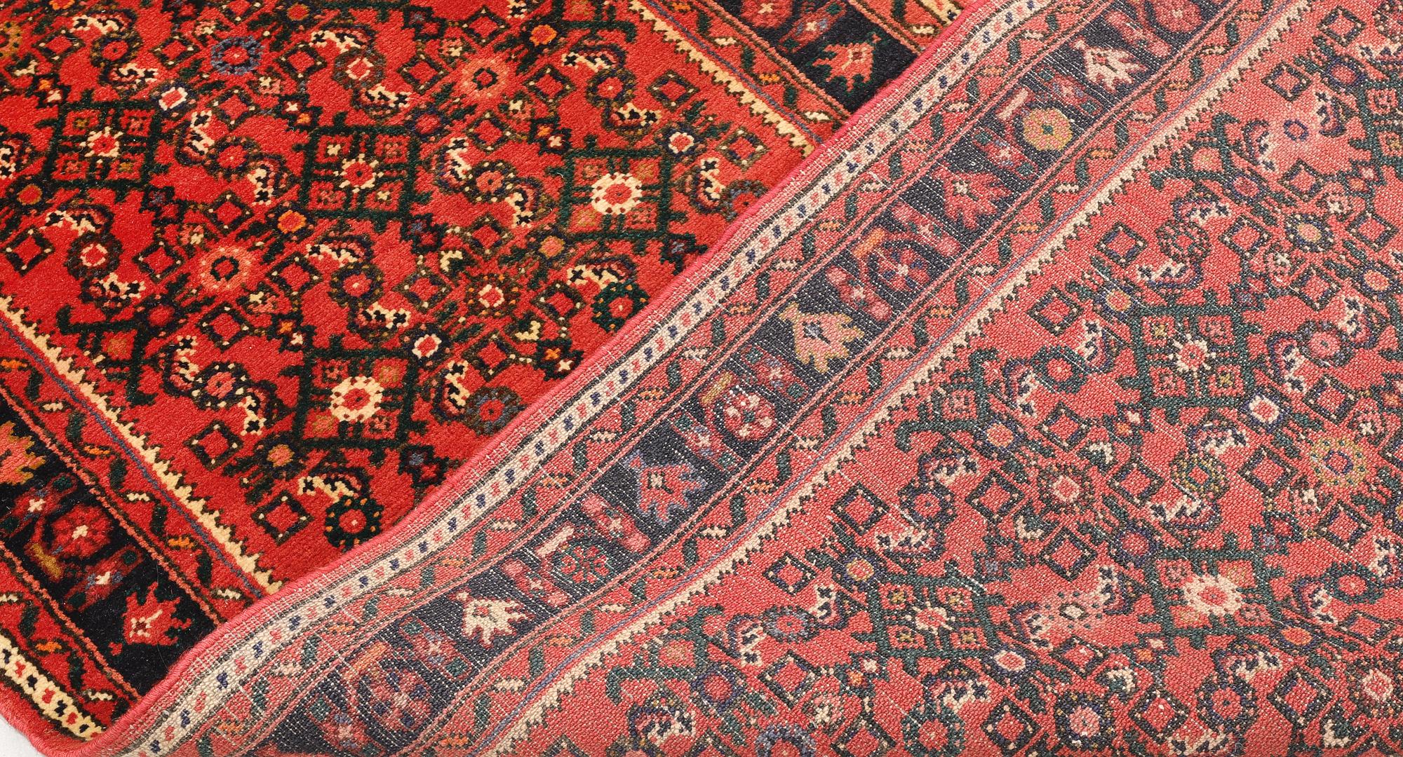 A Hosseinabad runner, c. 384 x 80 cm.