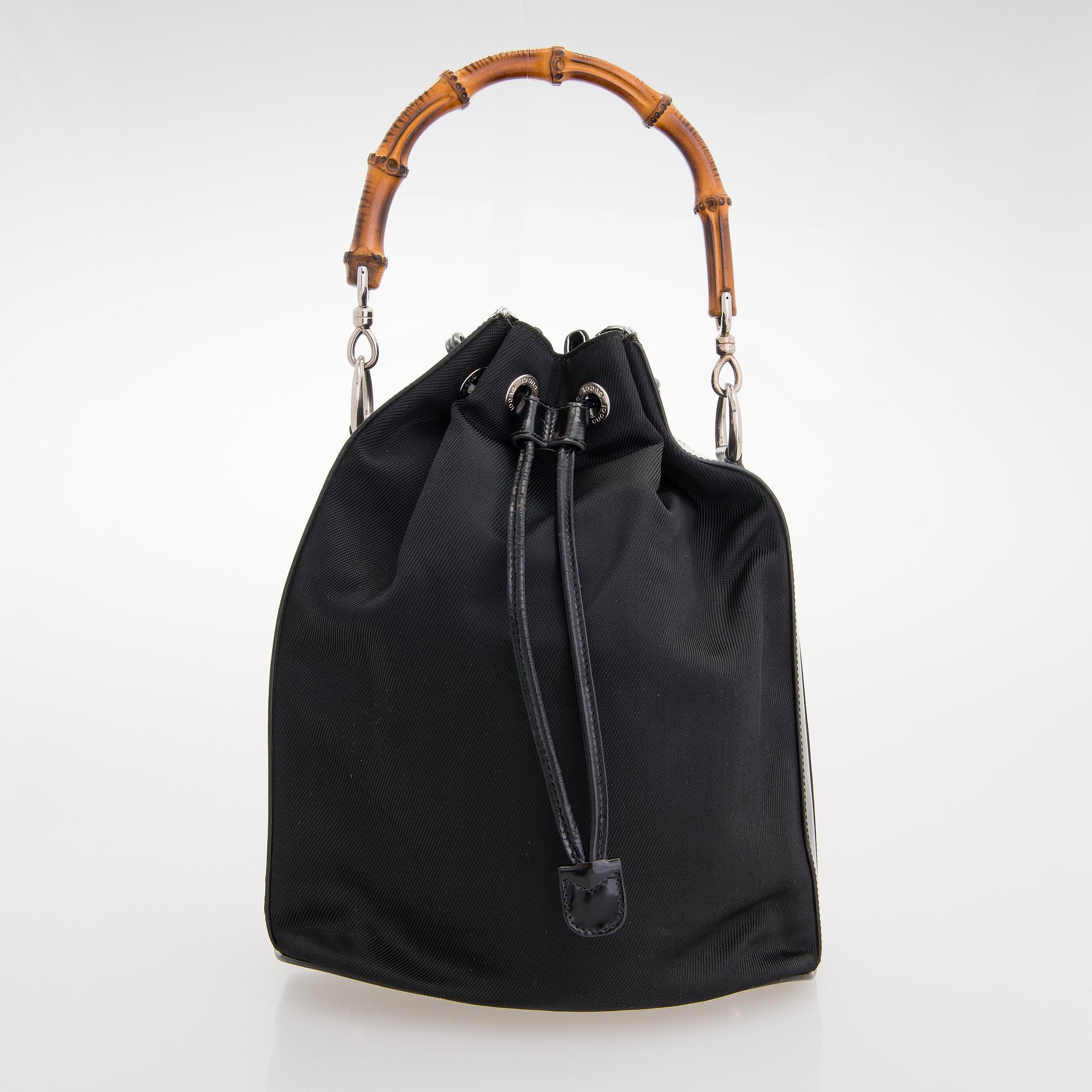 GUCCI, a black nylon handbag.