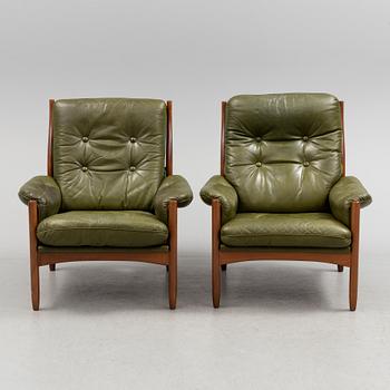 A pair of stained beech and leather easy chairs from Göte Möbler, Nässjö, second half of the 20th century.