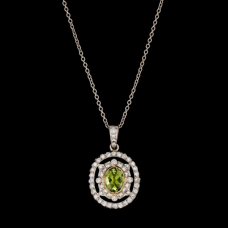 A peridote and brilliant cut diamond pendant, tot. app. 1 cts.