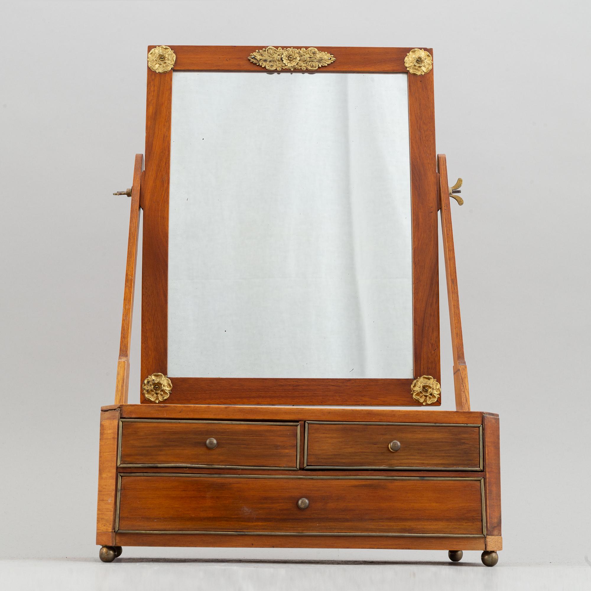 An Empire table mirror, first half of the 19th century.