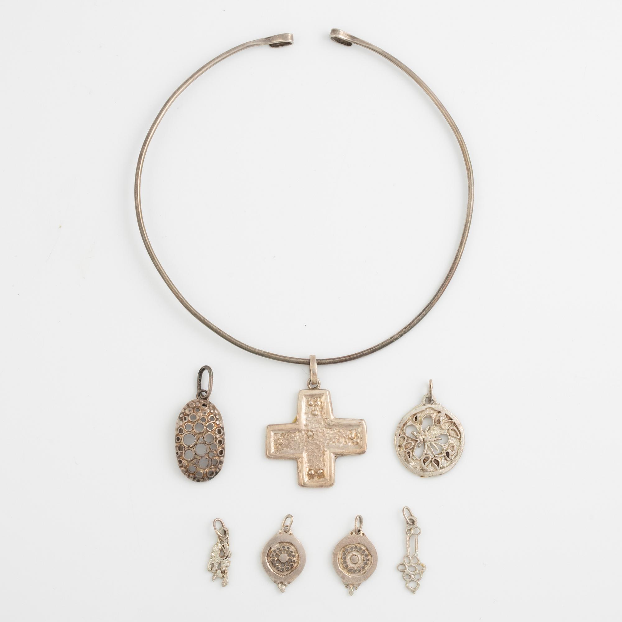 Lars Arby, a neck ring and seven pendants, silver, Gothenburg 1966, 1977 and 1982.