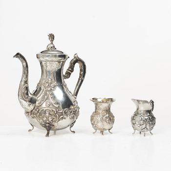 A silver Rococo style coffee pot, creamer and sugar bowl, Swedish import mark of Gewe Silvervarufabriken Ab, Malmö, 1977.