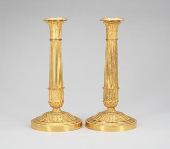 A pair of French Empire early 19th Century candlesticks.