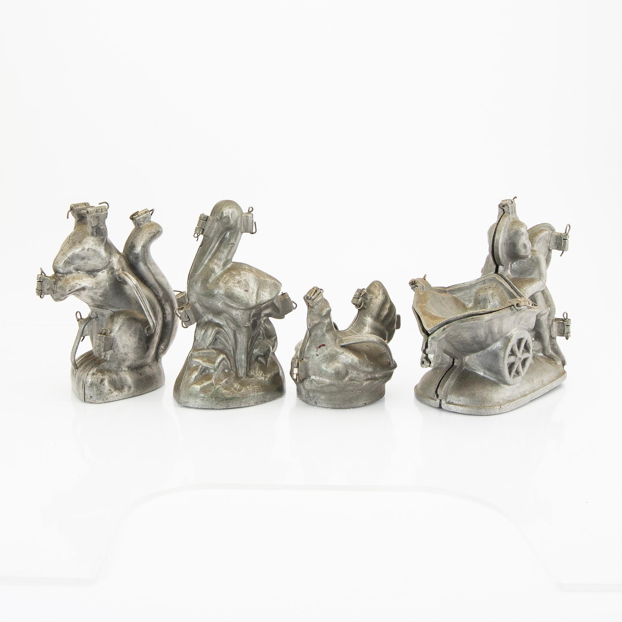 A set of four pewter icecream moulds around 1900.