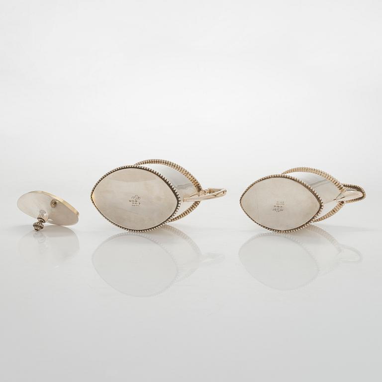 An early 20th century 4- piece sterling silver empire coffee set, C.G. Hallbergs Guldsmeds AB, Stockholm.