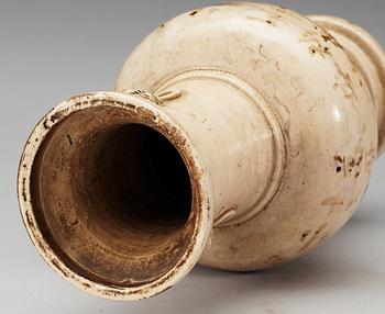 A cream glazed vase, Ming dynasty, with an inscription that dates it to 1608.