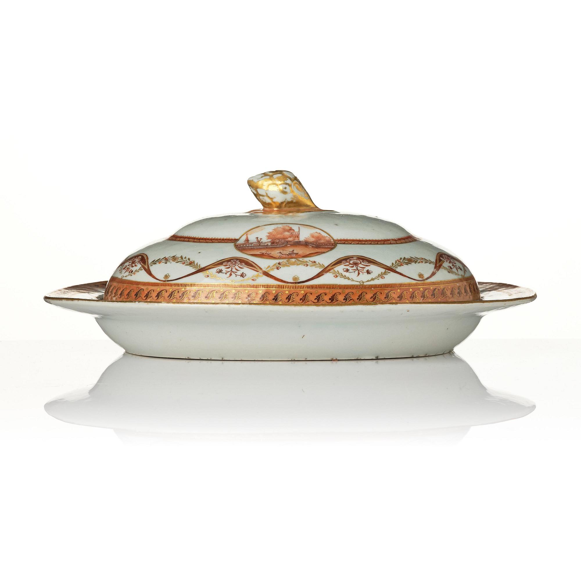 An oval vegetable tureen with cover and a pillow shaped bowl, Qing dynasty, late 18th century.
