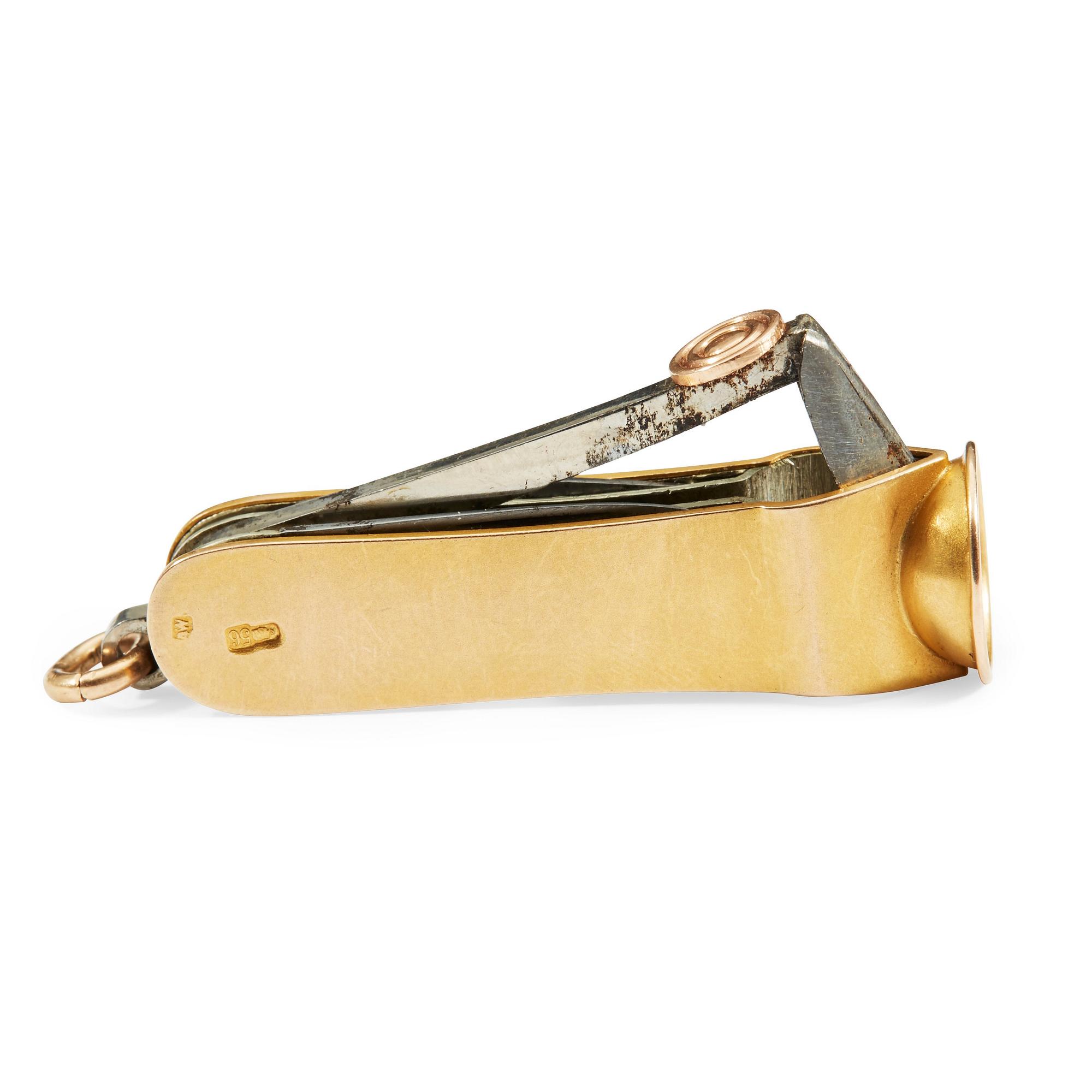 A Russian 20th century gold and metal cigar-cutter, unidentified makers mark, St. Petersburg 1908-1917.