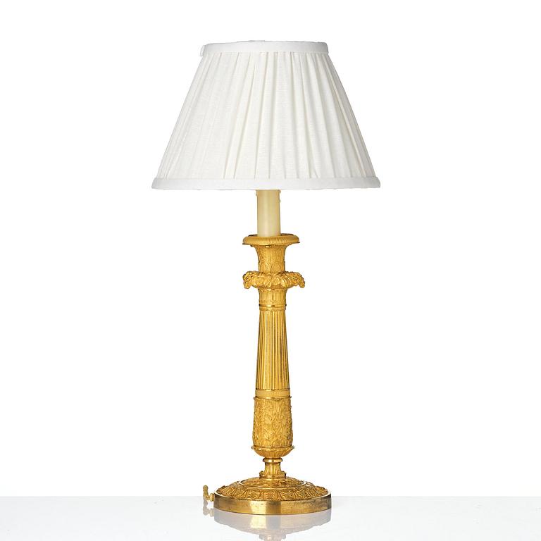 A French Empire ormolu bronze table lamp, early 19th century.