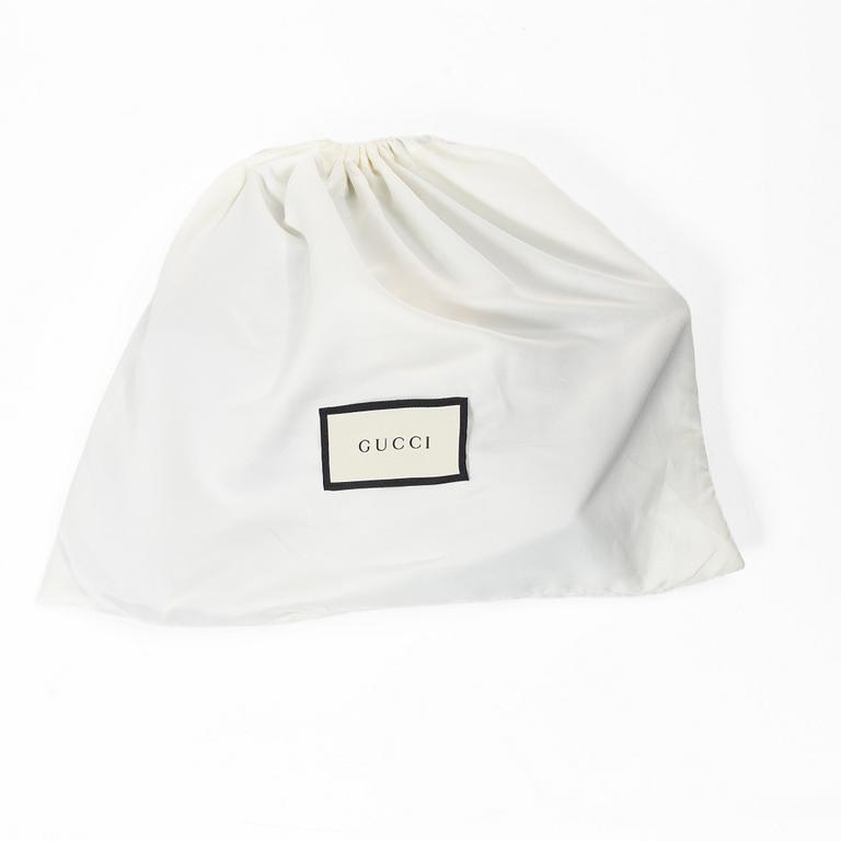 Gucci, a handbag.
