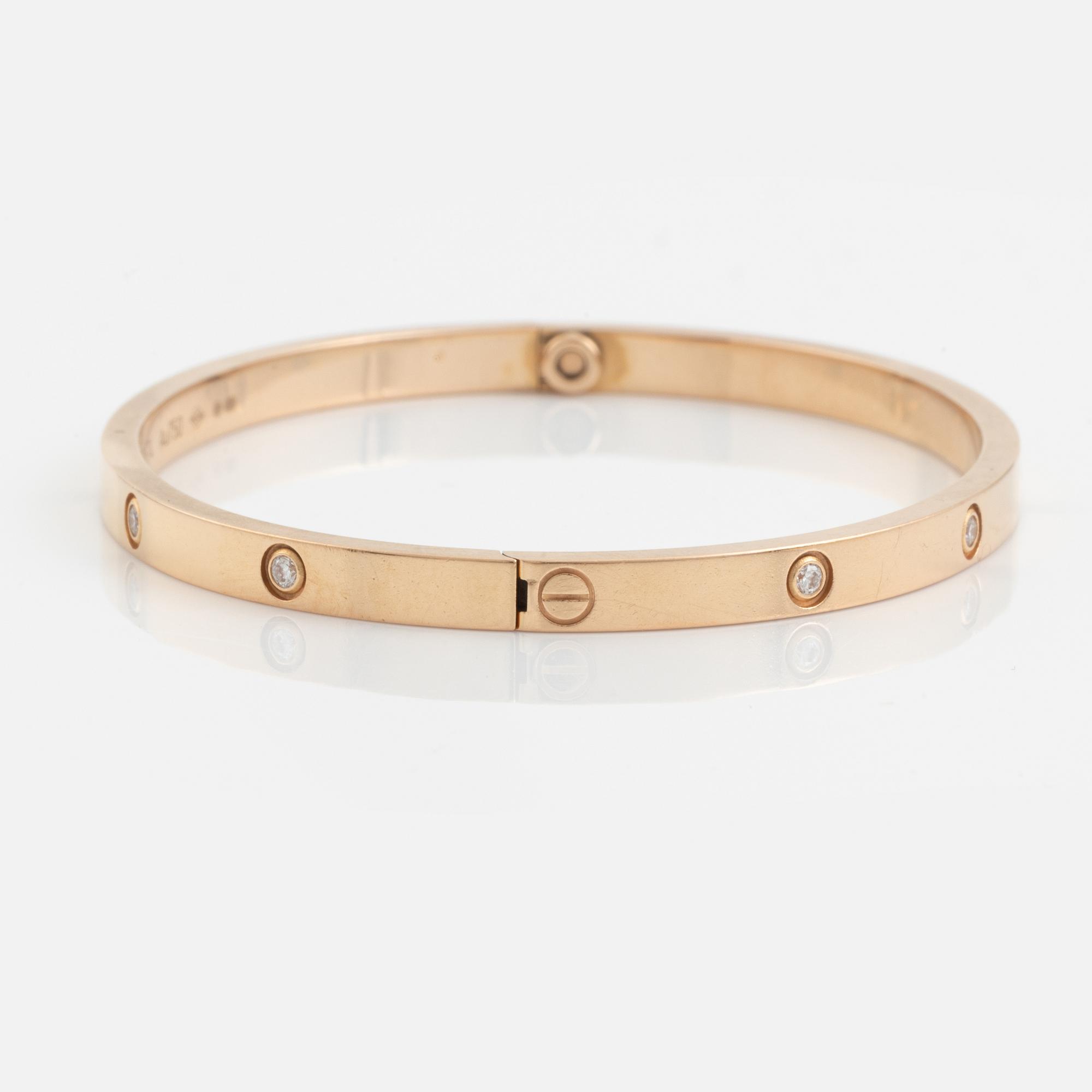 A Cartier "Love" bracelet small model in 18K rose gold with ten round brilliant-cut diamonds.