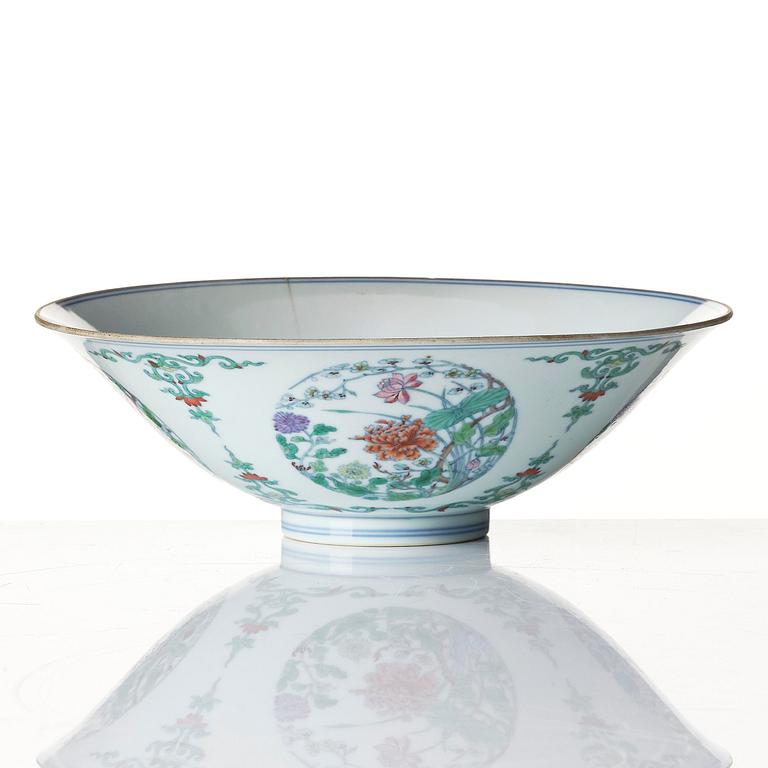 A doucai 'floral' bowl, Qing dynasty, Yongzheng mark and of the period (1723-35).