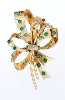 554. A gold, diamond and turquise 1950's brooch.