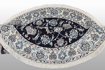 A rug, Nain, part silk, ca 140 x 140 cm.
