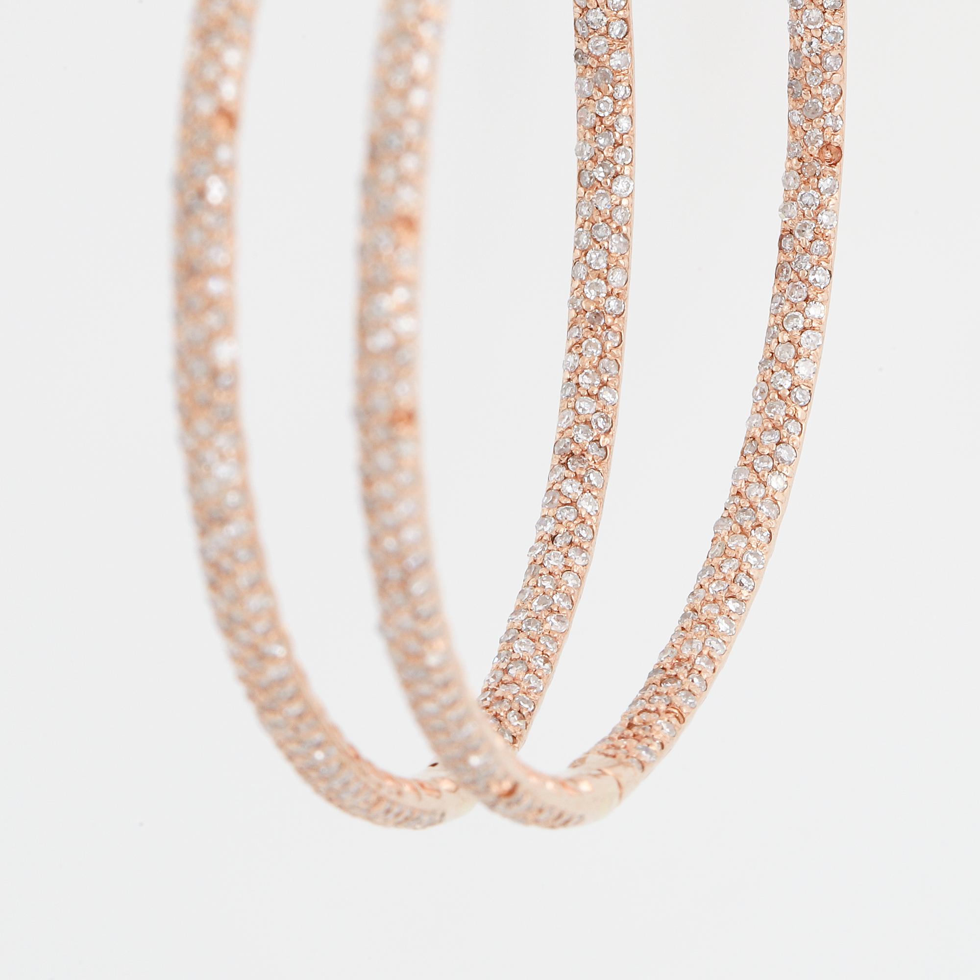 Rose gold and diamond hoop earrings.