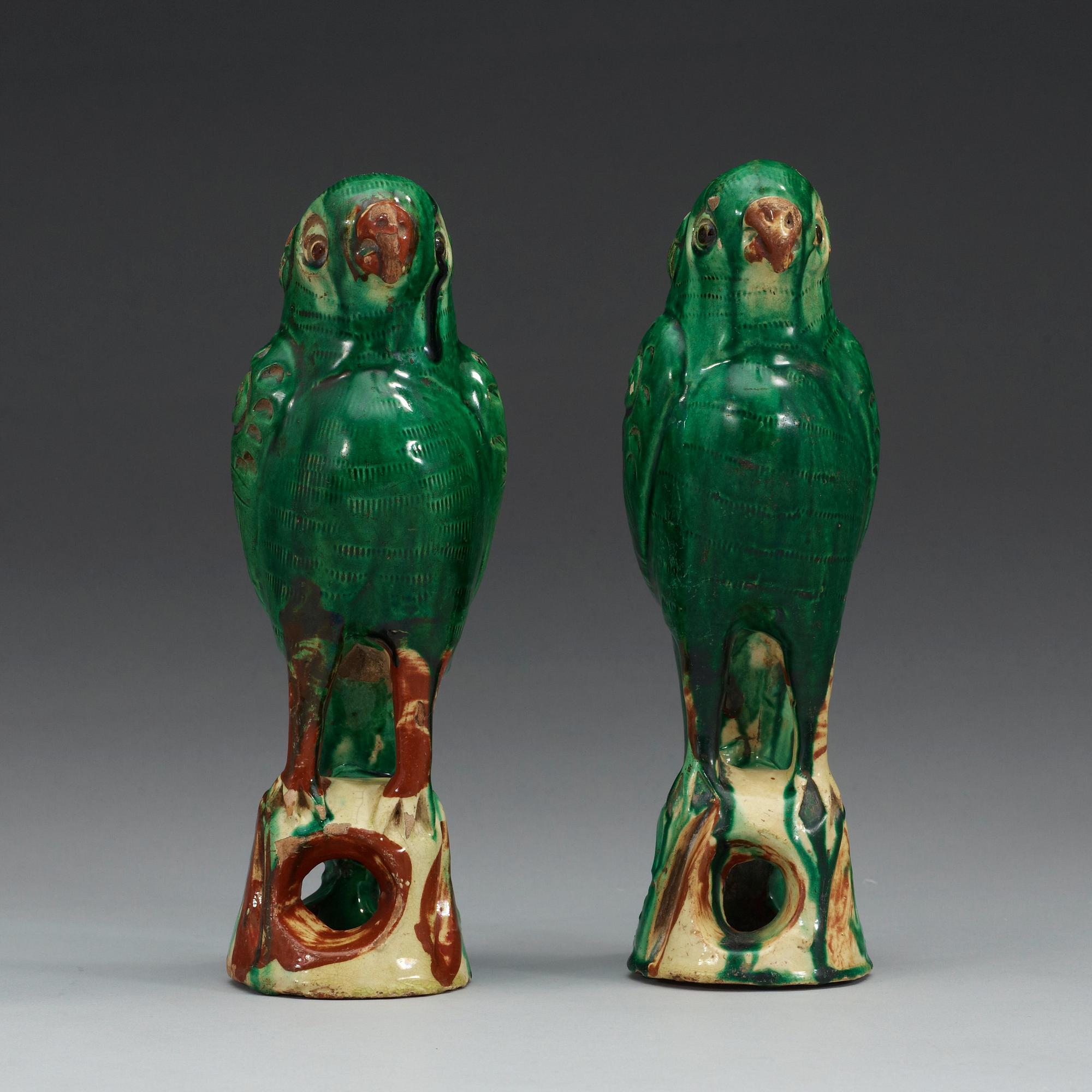 A set of two green glazed falcons, China.