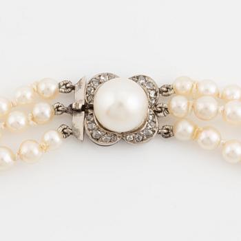 Three strand calibrated cultured pearl necklace, clasp with pearl and rose cut diamonds.