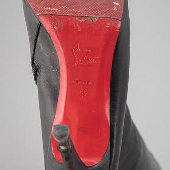 CHRISTIAN LOUBOUTIN, a pair of leather boots, size 37.