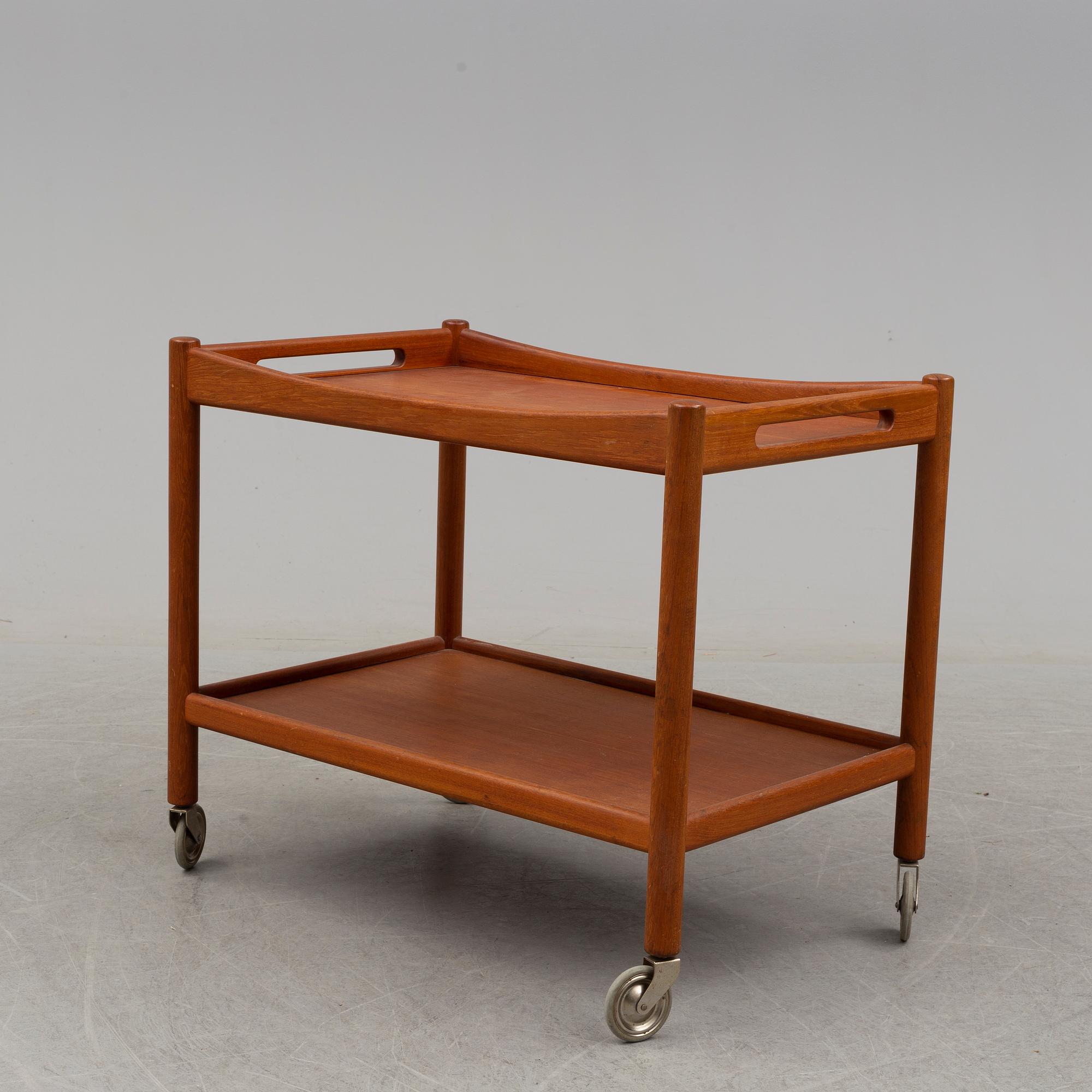 A mid 20th century teak serving trolley by Hans J Wegner, Andr. Tuck, Denmark.