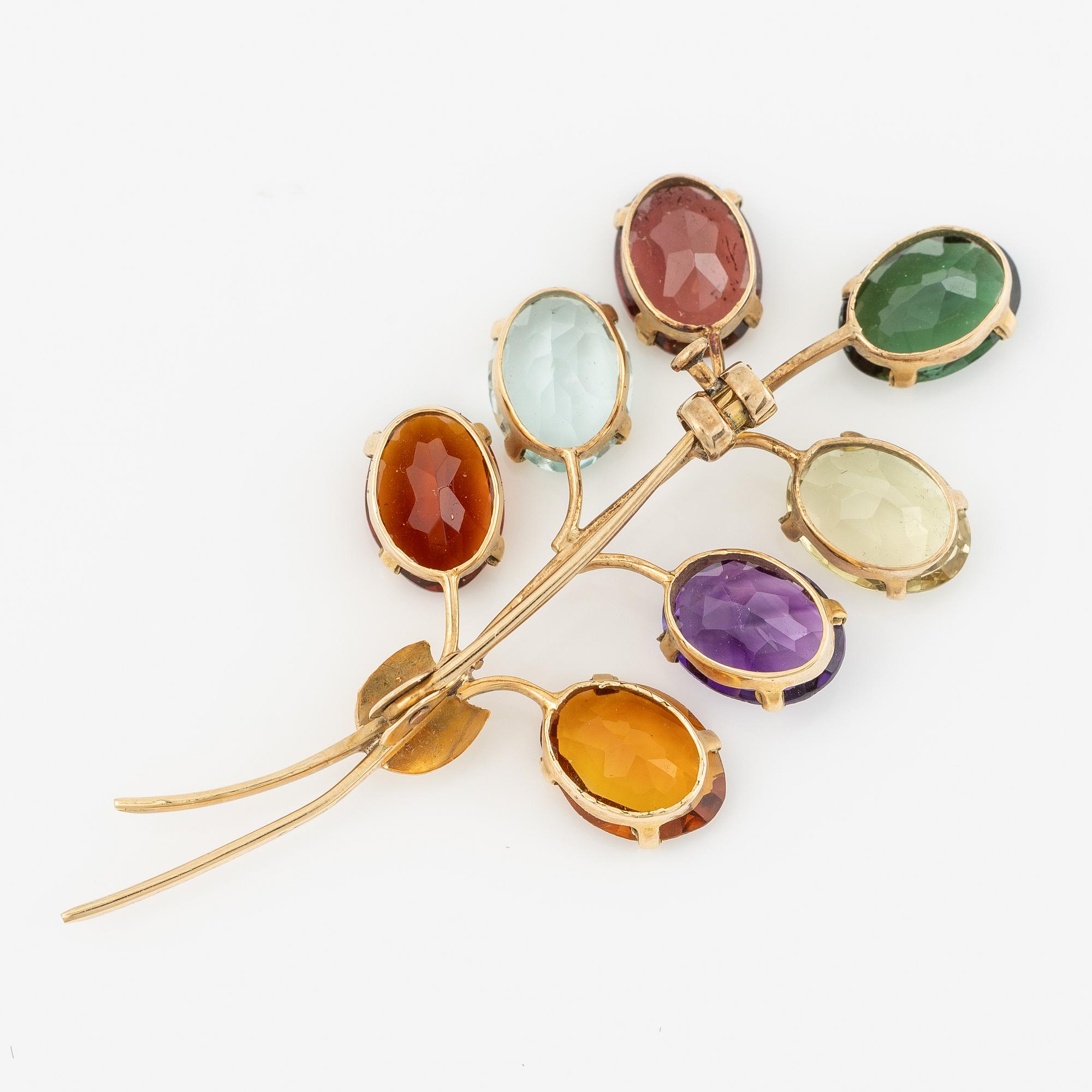 Brooch, 18K gold with citrine, amethyst, and tourmaline among others.