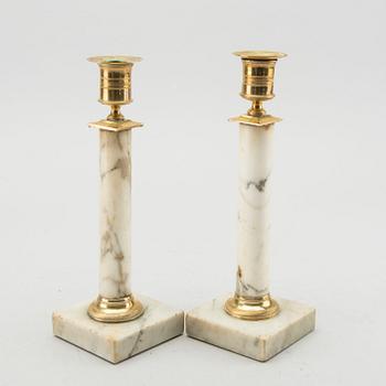 A pair of Late Gustavian marble candle sticks.