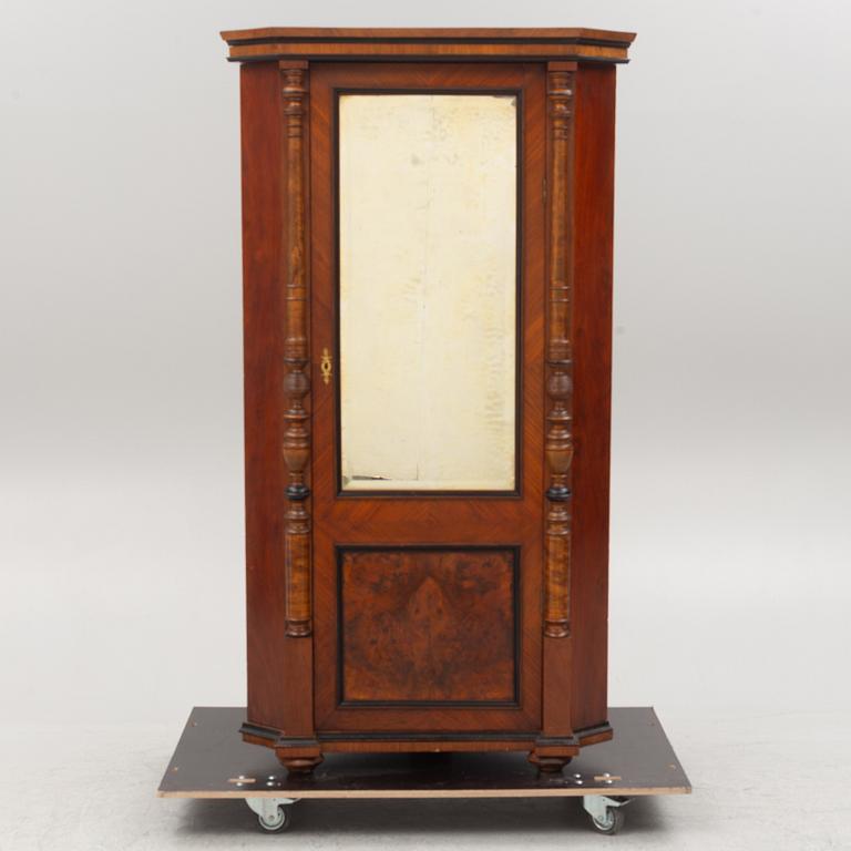 A corner cabinet, circa 1900.