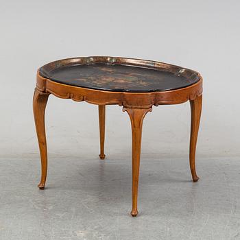A rococo style side table with a loose tray.
