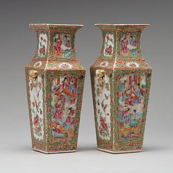 A pair of Canton famille rose vases, Qing dynasty, 19th Century.