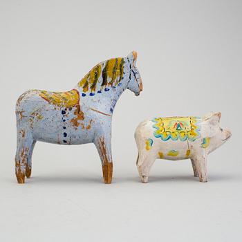 A painted folk art dala horse and dala pig, first half of the 20th century.