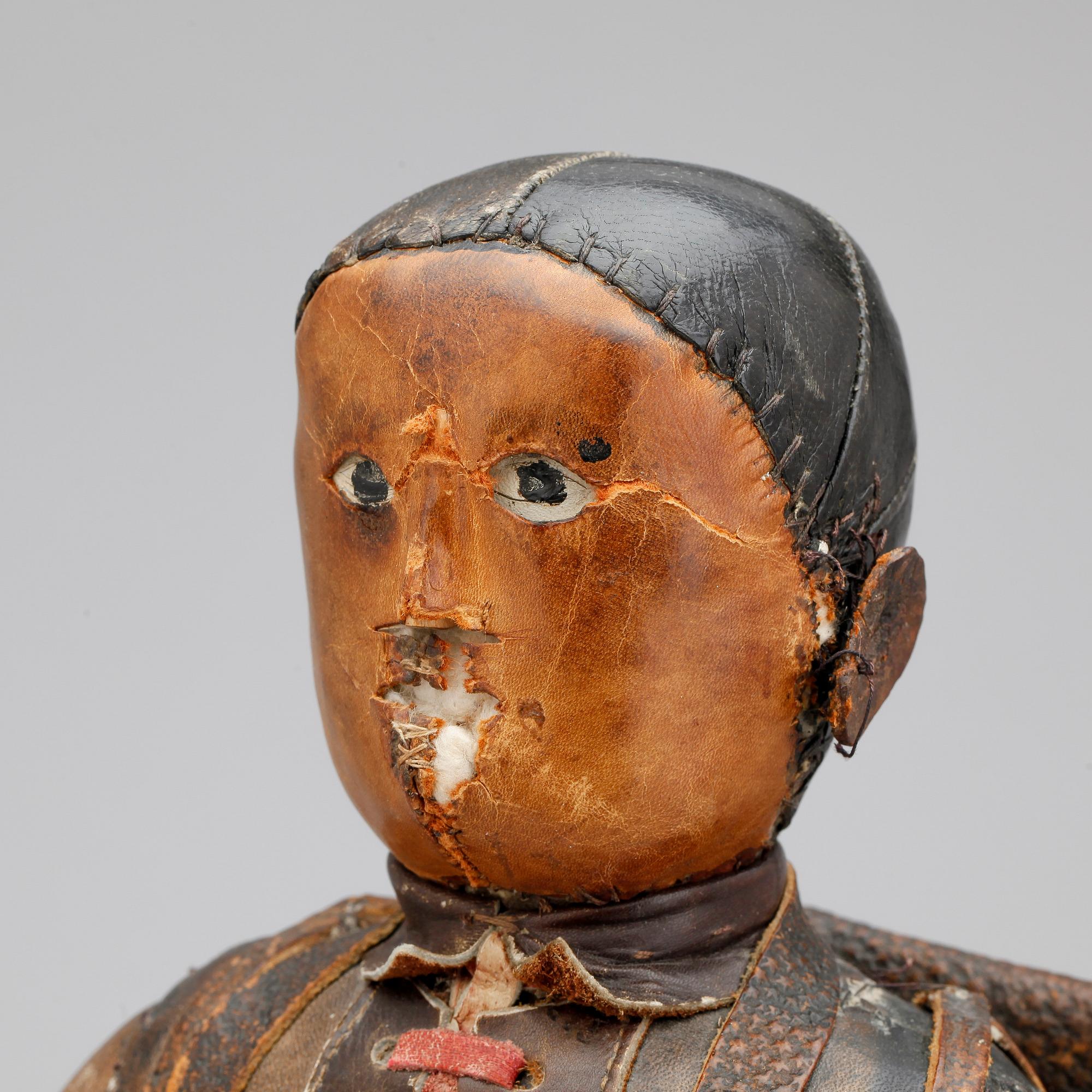 DOCKA, läder, 1800-tal.