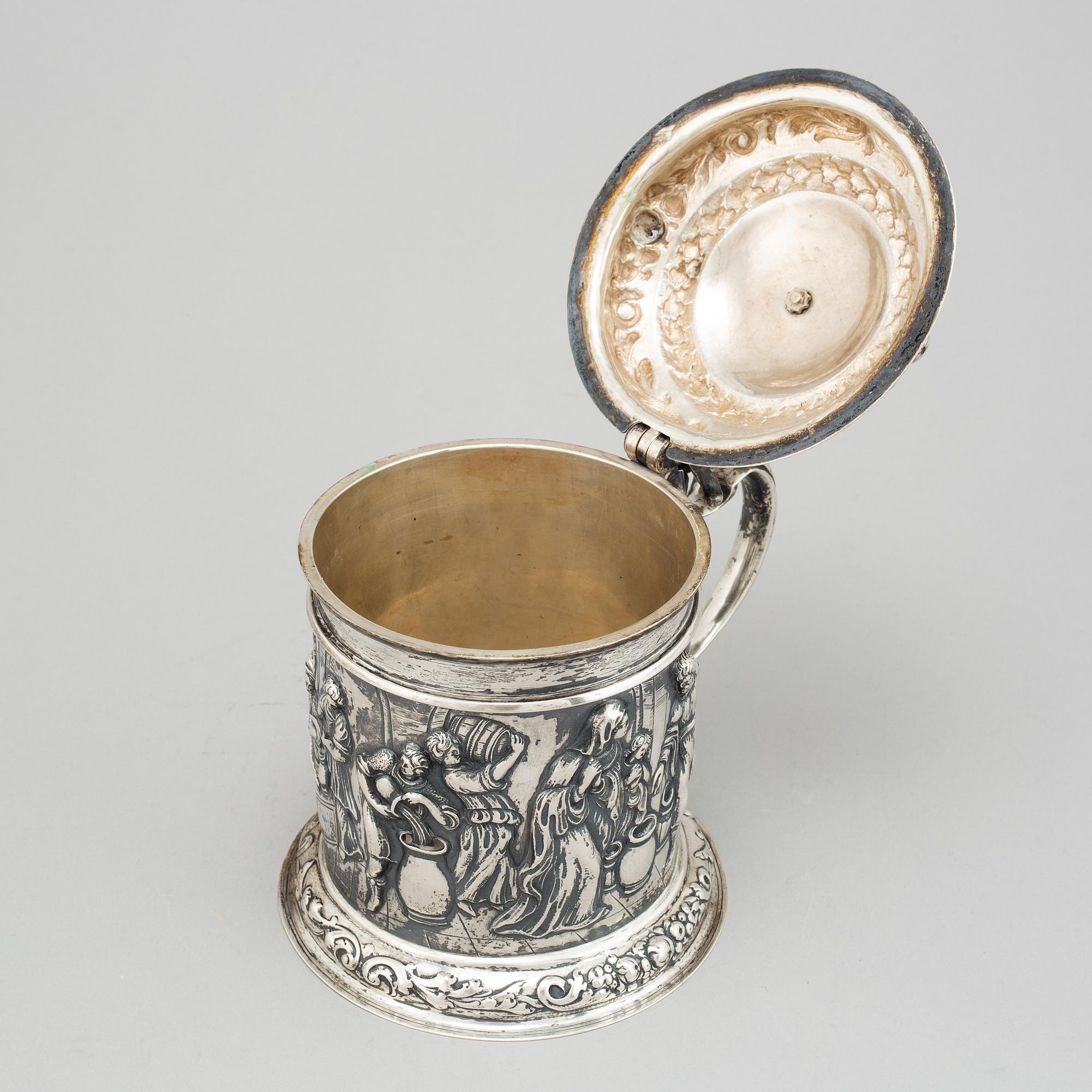 A silver baroque style tankard.